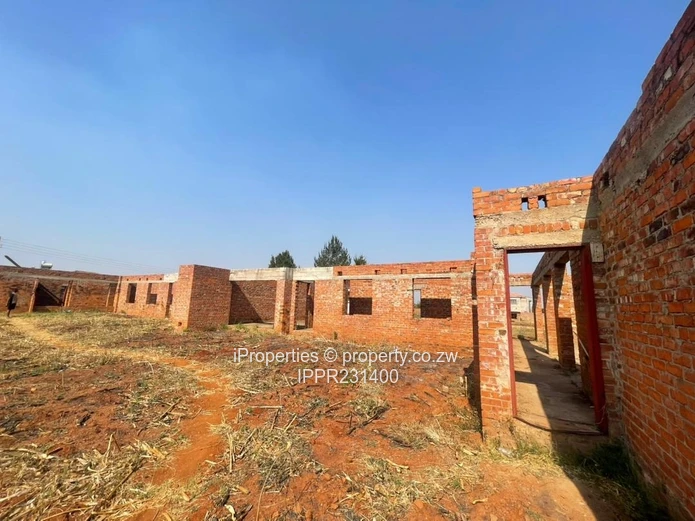 Spacious 2,000m² Corner Stand with Incomplete Multi-Unit Development