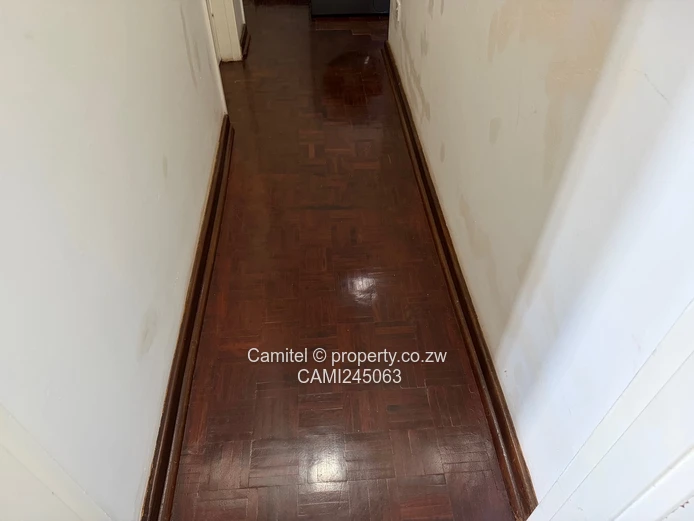 Chinamano Heights:Parquet-Floored 2-Bed Avenues Flat with Borehole (Sole Mandate)