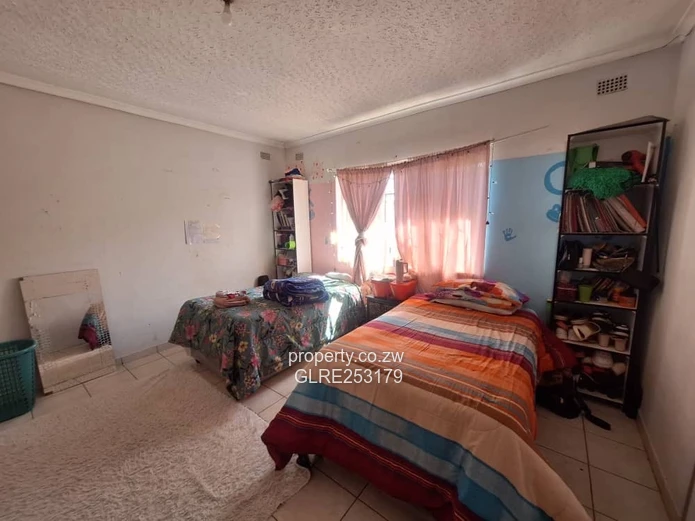 Brick 4-Bed Home — Verandah, Water Tank & Walled Yard