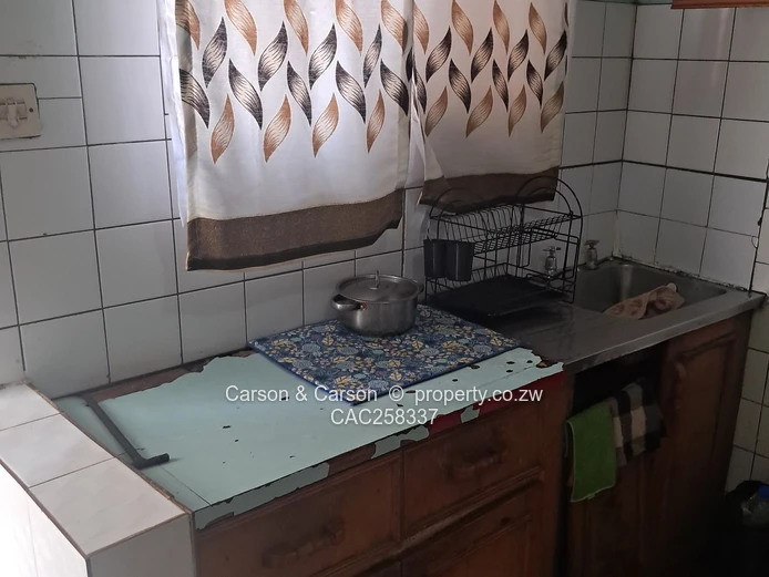 Mufakose 2 bedroom flat lounge fitted kitchen combined toilet and bathroom on ground floor 
