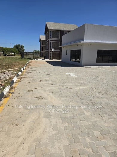 Mkoba Retail — Glass Front, Paved Forecourt & Borehole