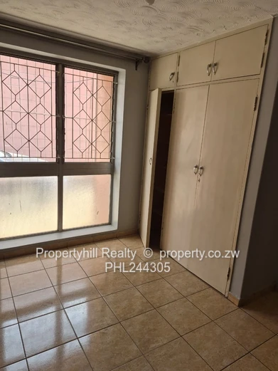 Harare CBD Avenues: 2-Bed Flat 80sqm — Borehole & Paved Yard (Sole Mandate)