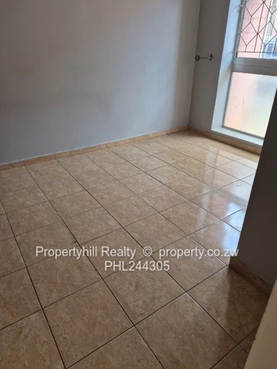 Harare CBD Avenues: 2-Bed Flat 80sqm — Borehole & Paved Yard (Sole Mandate)