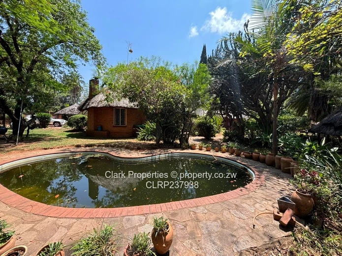 Spacious One-Acre Property with Unique Thatched Residence