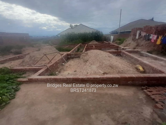 Serviced Residential Stand for Sale with Unfinished Structure