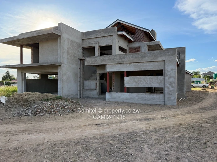 Incomplete 4 Bed double storey with a 3 bed cottage with title deed