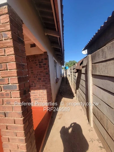 Walled 3-Bed Brick Home with Verandah in Kuwadzana
