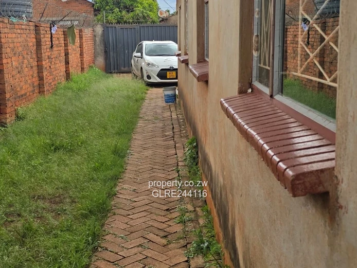 Tiled 2-Bed Kuwadzana Home — Borehole & Parking