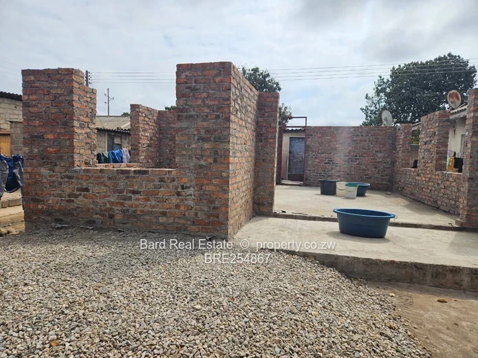 4-Bed Unfinished Brick Shell in Seke - Garden & Verandah