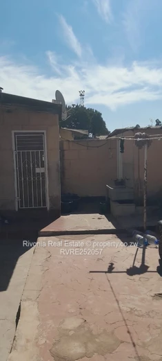 2-Bed Tiled Home with Walled Yard & Access Control