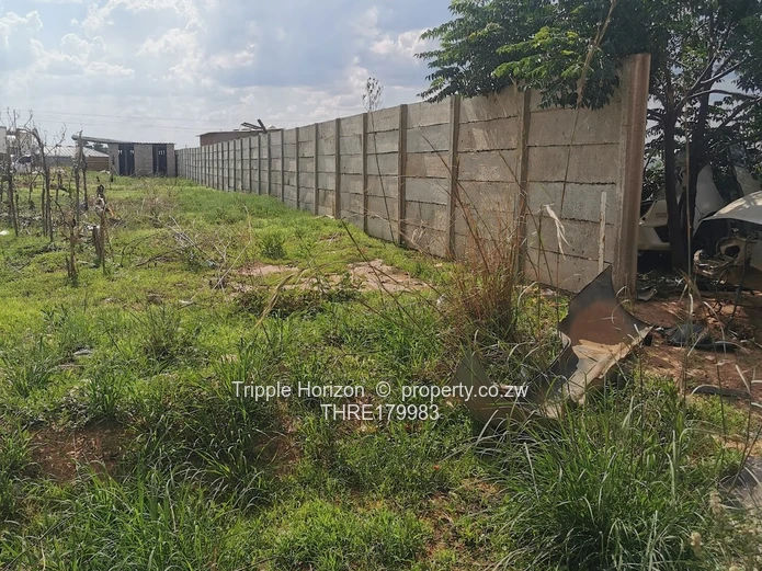 Walled 1,200 m² Commercial Plot — Damofalls Main Rd