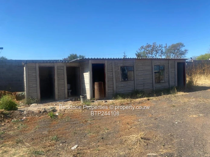 Spacious 2,420m² Walled Industrial Yard with Workshop — Bulawayo CBD