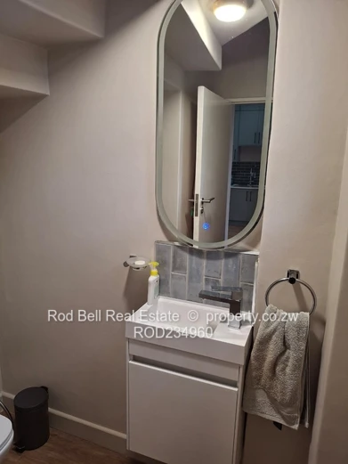 Chisipite 2-Bed Townhouse — Pool, Garden & Balcony