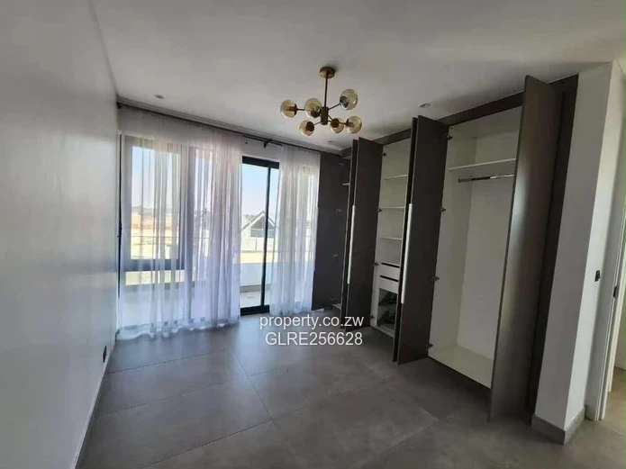 Borrowdale: Modern 4-Bed Apt w/ Glass Balconies & Borehole