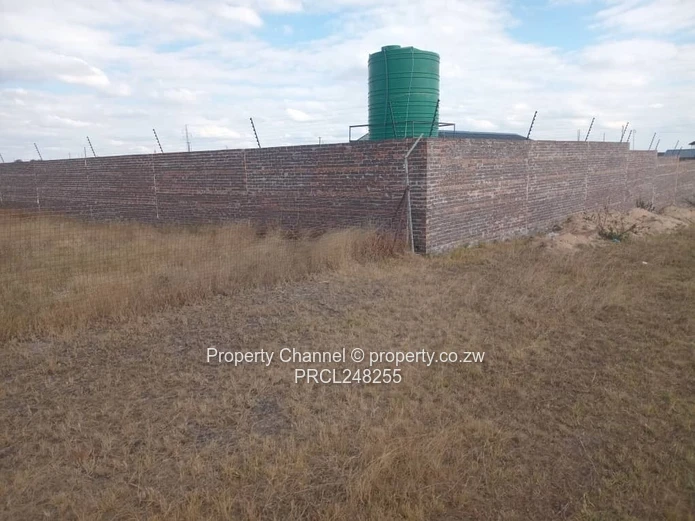 5,000 sqm Level Plot in 8km west of Gweru CBD — Open Grass, Adjacent Walled Property