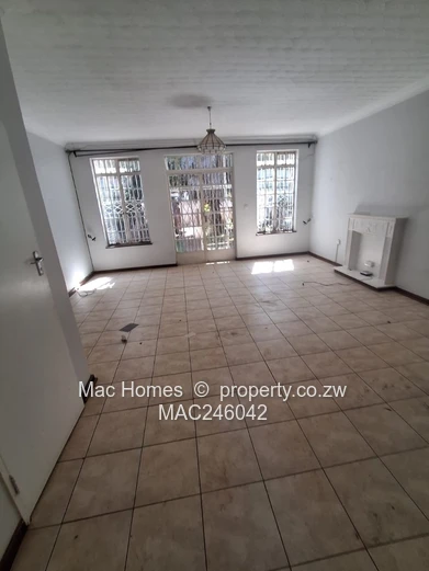 Bright 2-Bed Garden Flat Harare CBD — Water Tank & Carport