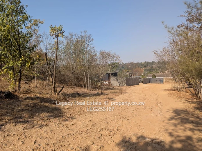 4472 m² Greystone Park — Sloping Stand with Cottage, Trees and Gate