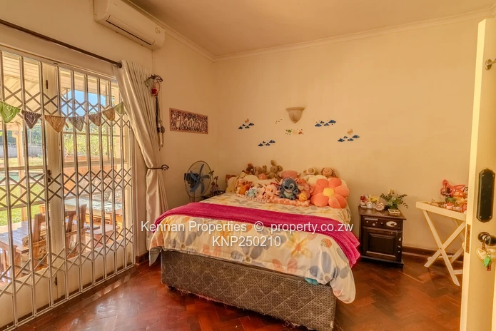 Attractive five bedroom home on two and a half acres. Good water and Msasa trees. (Sole Mandate)