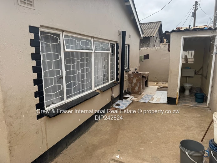 Unit L Seke 3 beds house with a cottage for sale