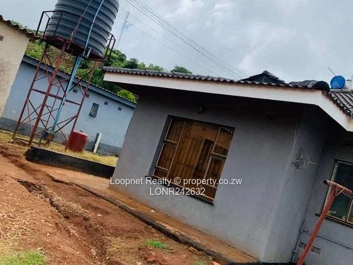 Brick-accented 3-Bed Concession Home with Borehole