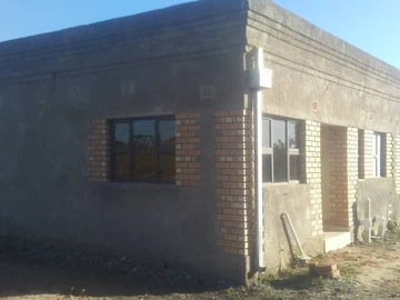 Stand with a cottage for sale