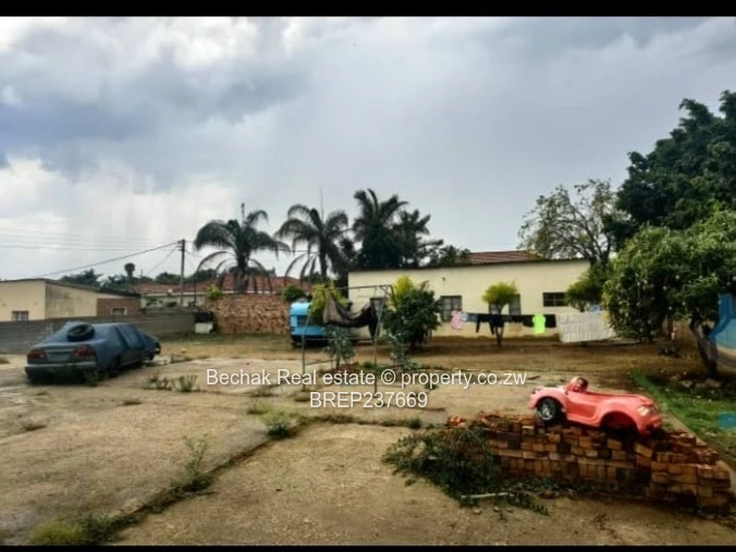 Walled 1BR on 1,200m² — Flatlet, Paved & Good ZESA