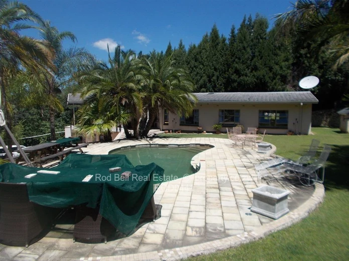 This property offers 2 homes and is set amongst stunning msasa trees