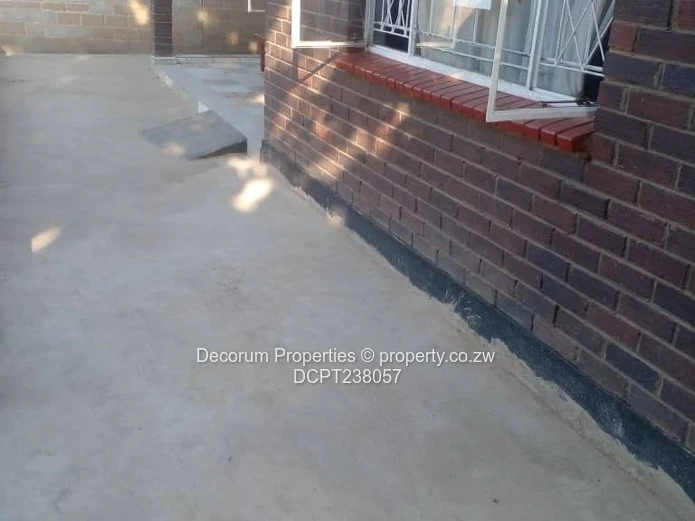 Chitungwiza: 2-Bed, 4-Bath Walled Brick Home, Paved Yard