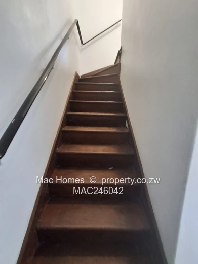 Bright 2-Bed Garden Flat Harare CBD — Water Tank & Carport