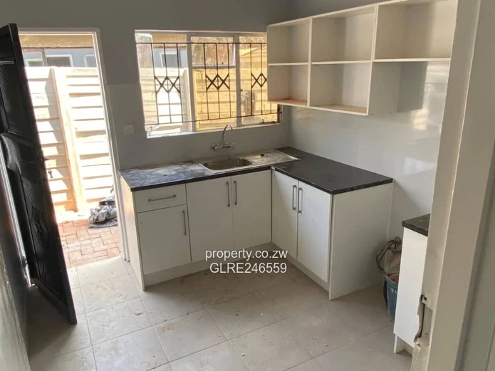 For Sale 4-Bed 2 Apartments Townhouse Complex in Budiriro Cabs  - Walled, Paved, Fitted Kitchens