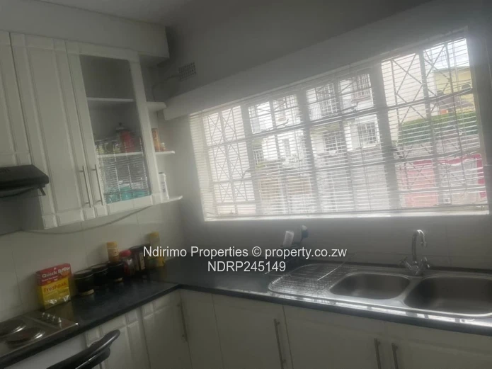 Secure 2-Bed Harare CBD Flat with Balcony, Garden & Modern Kitchen