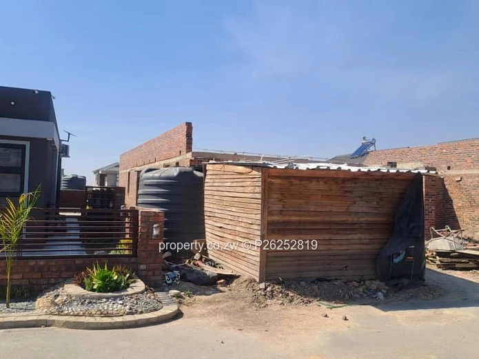 An lncomplete 4 bedroomed house left with finishings for sale in Arlington East , Harare  