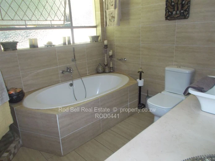 This property offers 2 homes and is set amongst stunning msasa trees