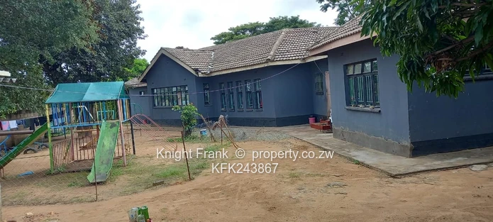 Walled 6-Bed Home with Verandah & Garden — Msasa Park