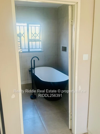 Budiriro 4-Bed House — 3 Baths, Freestanding Tub