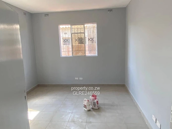 For Sale 4-Bed 2 Apartments Townhouse Complex in Budiriro Cabs  - Walled, Paved, Fitted Kitchens