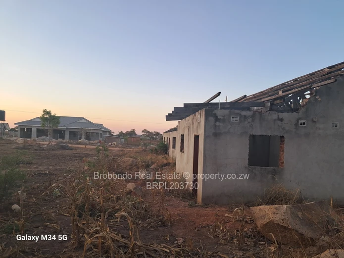 Incomplete house on roof level. 